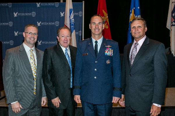 Together at the October luncheon are (l-r) Rob Lehman, recipient of the Young AFCEAN Award; Don Carmichael, recipient of the Super NOVA Award; Gen. Killough; and Ron Zich, chapter president.